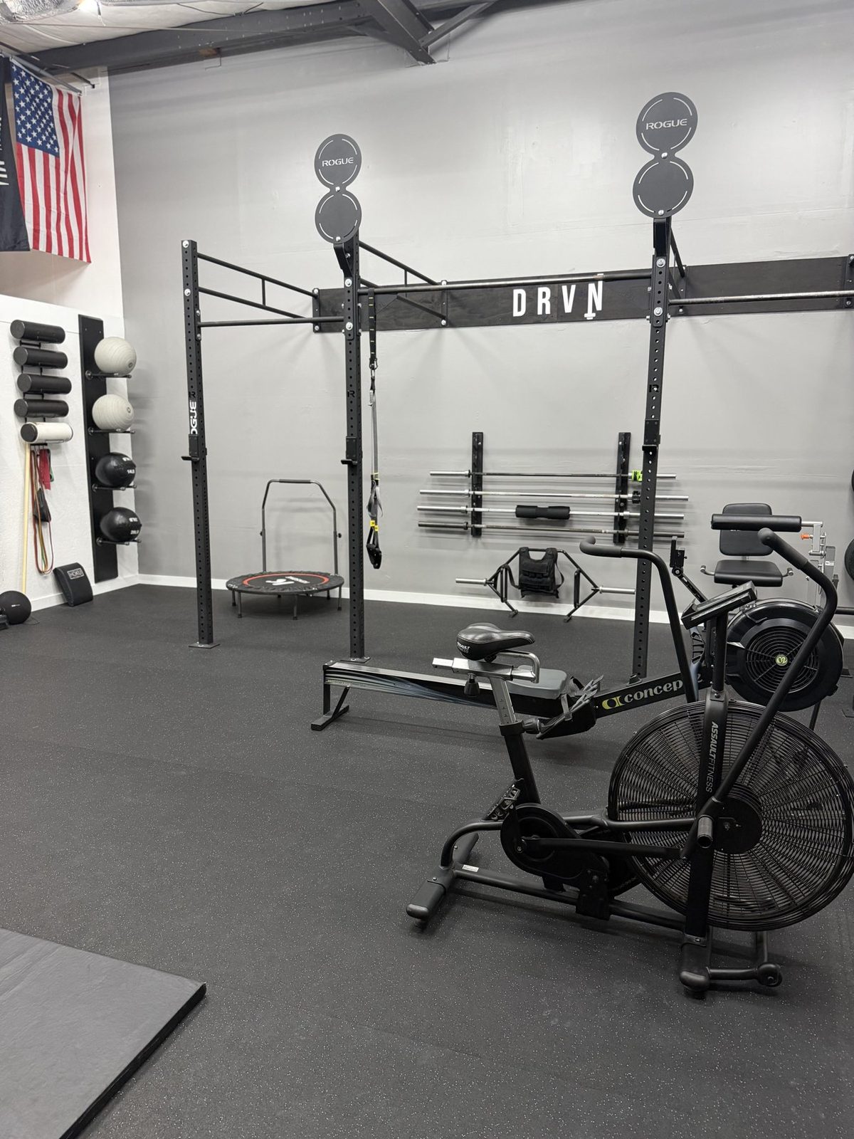 The DRVN open gym in Surfside Beach with rig, rower and air bike, ready for drop-in athletes